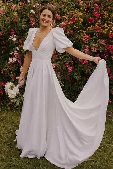 Vestido de novia largo con escote en V profundo y mangas abullonadas con espalda abierta